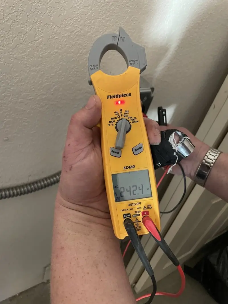 Voltage testing with clamp meter during Aluminum Wiring Replacement in River Ridge